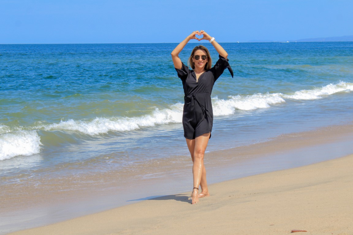 Marilu walking along the ocean